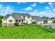 Spacious two-story home featuring a manicured lawn, inviting porch, and an attached garage, perfect for luxury living at 1581 S 825 E, Zionsville, IN 46077