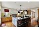 Spacious kitchen featuring a large island with marble countertop and wooden floors at 1581 S 825 E, Zionsville, IN 46077