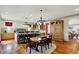 Eat-in kitchen with a large island, breakfast table, and hardwood floors at 1581 S 825 E, Zionsville, IN 46077