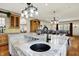Open kitchen with marble island and a view into the living room at 1581 S 825 E, Zionsville, IN 46077