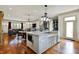 Open concept kitchen with marble island flowing into the living and dining areas at 1581 S 825 E, Zionsville, IN 46077