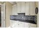 Clean laundry room with plenty of counter space and overhead cabinets at 1581 S 825 E, Zionsville, IN 46077