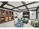 Cozy living room features coffered ceilings, a built-in wine rack, and a stylish wet bar at 1581 S 825 E, Zionsville, IN 46077