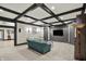 Spacious living room with coffered ceilings, built-in shelving, and a comfortable seating area at 1581 S 825 E, Zionsville, IN 46077