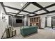 Cozy living room with coffered ceilings, built-in shelving, and comfortable seating at 1581 S 825 E, Zionsville, IN 46077
