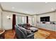 Comfortable living room with a large sectional sofa, hardwood floors, and ample natural light at 1581 S 825 E, Zionsville, IN 46077