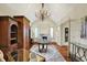 Luxurious living room with fireplace, gorgeous chandelier, and gleaming hardwood floors at 1581 S 825 E, Zionsville, IN 46077