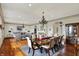 Open concept living and dining area with hardwood floors, elegant furnishings, and abundant natural light at 1581 S 825 E, Zionsville, IN 46077