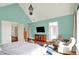 Bright primary suite with vaulted ceiling, hardwood floors, sitting area, and ample closet space at 1581 S 825 E, Zionsville, IN 46077