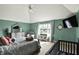 Well-lit main bedroom featuring neutral-colored carpet and bright green walls at 1581 S 825 E, Zionsville, IN 46077