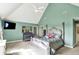 Brightly painted main bedroom with a ceiling fan, tv and a crib at 1581 S 825 E, Zionsville, IN 46077