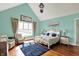 Vaulted primary suite offers hardwood floors, natural light, and picturesque views of the yard at 1581 S 825 E, Zionsville, IN 46077