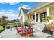 Outdoor patio area with a swing, seating, and beautifully landscaped backyard at 1581 S 825 E, Zionsville, IN 46077