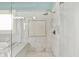 A large glass shower with sleek marble tile, custom mosaic tile inset, and modern fixtures at 1581 S 825 E, Zionsville, IN 46077