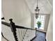 Looking down on a staircase with decorative chandelier and patterned rug visible below at 1581 S 825 E, Zionsville, IN 46077