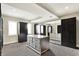 Large walk-in closet with custom cabinetry, mirrored doors, and ample storage space at 1581 S 825 E, Zionsville, IN 46077
