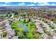 Picturesque neighborhood with well-manicured lawns, tree-lined streets, and a tranquil pond, offering a peaceful suburban lifestyle at 15890 Concert Way, Noblesville, IN 46060