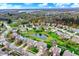 Beautiful suburban neighborhood with lush green spaces, serene pond, and well-maintained homes, offering a tranquil lifestyle at 15890 Concert Way, Noblesville, IN 46060