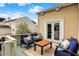 A comfortable back deck with outdoor furniture and a view of the surrounding landscape at 15890 Concert Way, Noblesville, IN 46060