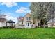 Spacious backyard with deck, patio, and lush lawn, perfect for outdoor activities and relaxation at 15890 Concert Way, Noblesville, IN 46060