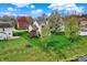 Beautiful backyard featuring lush lawn, mature trees, and a well-manicured garden at 15890 Concert Way, Noblesville, IN 46060