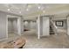 Spacious finished basement featuring neutral carpet, recessed lights, wood table, and several doorways at 15890 Concert Way, Noblesville, IN 46060