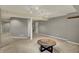Spacious finished basement featuring neutral carpet, recessed lights, wood table, and several doorways at 15890 Concert Way, Noblesville, IN 46060