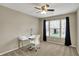 Bright bedroom featuring a modern desk with a view from the window and a comfortable work space at 15890 Concert Way, Noblesville, IN 46060