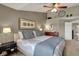 Comfortable bedroom with a queen-sized bed, soft lighting, and stylish decor at 15890 Concert Way, Noblesville, IN 46060