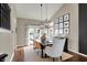 Dining room showcases modern chandelier and seating for Gathering dinners at 15890 Concert Way, Noblesville, IN 46060