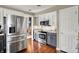 Well-equipped kitchen featuring modern appliances, hardwood floors, and ample cabinet space at 15890 Concert Way, Noblesville, IN 46060