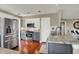 Updated kitchen with stainless steel appliances, granite countertops, and dark wood flooring at 15890 Concert Way, Noblesville, IN 46060