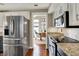Clean kitchen with stainless steel fridge, modern appliances, and bright lighting, perfect for cooking at 15890 Concert Way, Noblesville, IN 46060