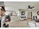 Open concept living area with eat in kitchen, chairs, and living room at 15890 Concert Way, Noblesville, IN 46060