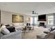 Spacious living room featuring a fireplace, large comfortable sofa, and plush seating for relaxation at 15890 Concert Way, Noblesville, IN 46060