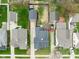 Birds eye view of a house and its backyard including a detached garage and neighboring homes at 1646 Fisher Ave, Indianapolis, IN 46224
