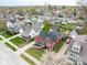 View of the home in a residential area with other houses and a garage in the backyard at 1646 Fisher Ave, Indianapolis, IN 46224