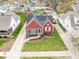 Overhead shot of a red house with a well-maintained lawn and surrounding neighborhood homes at 1646 Fisher Ave, Indianapolis, IN 46224