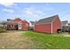 Spacious backyard featuring a patio, storage shed, and lush green grass at 1646 Fisher Ave, Indianapolis, IN 46224