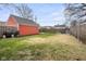 Spacious backyard with a shed, grill, and ample green space at 1646 Fisher Ave, Indianapolis, IN 46224