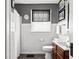 Cozy bathroom with tiled walls, a shower, and classic fixtures, offering a clean and functional space at 1646 Fisher Ave, Indianapolis, IN 46224