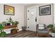 Stylish entryway with hardwood floors, modern decor, and a cozy seating area at 1646 Fisher Ave, Indianapolis, IN 46224