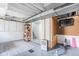 View of a bonus room acting as gym area with a TV and workout equipment at 1646 Fisher Ave, Indianapolis, IN 46224