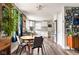 Bright kitchen and dining area with stainless steel appliances, white cabinets, and wood accents at 1646 Fisher Ave, Indianapolis, IN 46224