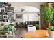 Open concept living room with wood floors, ample natural light, and decorative plants at 1646 Fisher Ave, Indianapolis, IN 46224