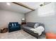 View of the living room with a sofa, accent chair, and soft lighting at 1646 Fisher Ave, Indianapolis, IN 46224