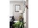 Living room featuring a sofa, end tables with greenery, and assorted framed pictures on the wall at 1646 Fisher Ave, Indianapolis, IN 46224
