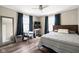 Comfortable main bedroom with natural light, ceiling fan, and a contemporary design at 1646 Fisher Ave, Indianapolis, IN 46224