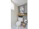 Here is a view of the toilet area of the bathroom, showing the toilet, shelf and window at 1646 Fisher Ave, Indianapolis, IN 46224