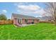 Backyard with a patio area, outdoor furniture, and a well-maintained lawn at 1707 Lafayette Ave, Lebanon, IN 46052